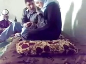 A female in a headscarf gets a checkup