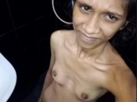 Lankan lady with puny milk cans takes a
