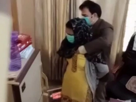 Paki physician inspects woman's bosoms