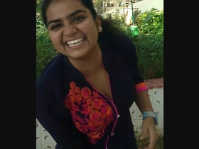 Priya, an Indian school girl, gives a